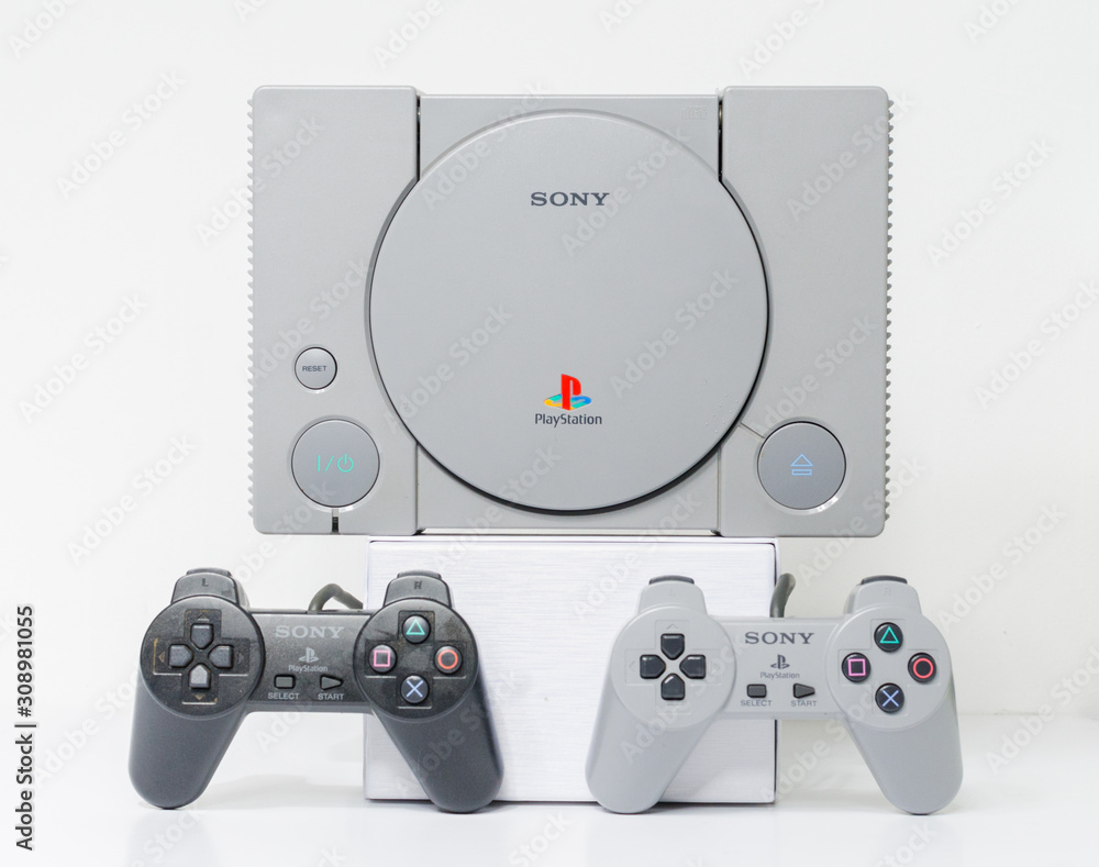Instrueren Magazijn Tweede leerjaar london, england, 07/05/2018 An original sony playstation console from 1994.  PS1 retro video game console. clean immaculate vintage console. Sonys game  hardware unit isolated on a white background. Stock Photo | Adobe Stock