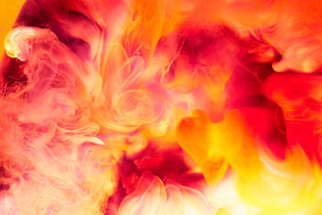 Abstract liquid yellow red fire background. Passion, sexual sensual love. Valentine's day concept, swirling smoke