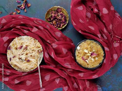 Seviyan or Vermicelli kheer, an Indian dessert made of semolina noodles topped with rose petals and dry fruits such as Cashews. photo