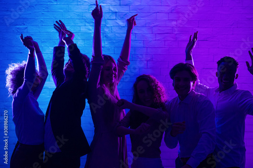 Joyful Millennial People Dancing Having Party In Office At Night
