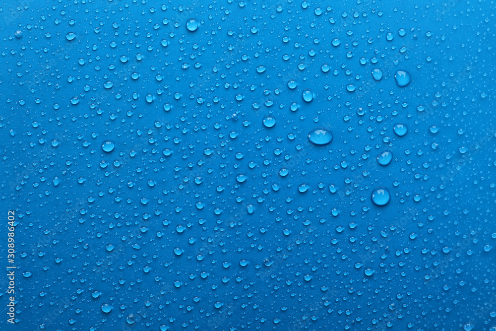 Water drops on light blue background, top view - obrazy, fototapety, plakaty 