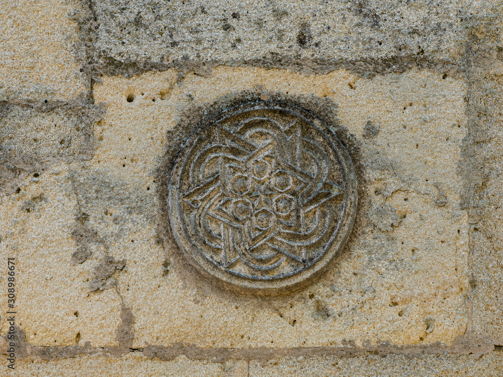 Close-up Fragment of the Ancient Armenian Fountain, XIV century, not far from the house of Aivazovsky, Feodosia, Crimea, Russia Close-up Fragment of the Ancient Armenian Fountain, XIV century, not far from the house of Aivazovsky, Feodosia, Crimea, Russia