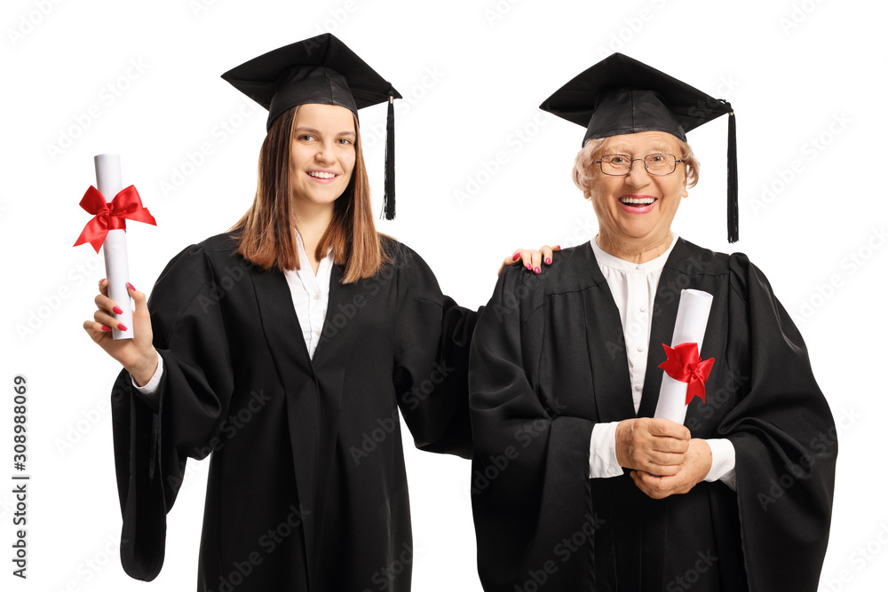 Young and senior female graduates holding diplomas Young and senior female graduates holding diplomas