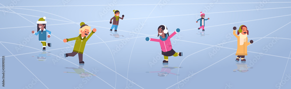 Fototapeta premium Children skating on ice rink winter sport