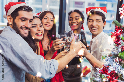 Group of business diversity colleague teamwork celebaring for New Year party in modern urban office background. Friends having enjoy party with alcoholivd drink together. Multi ethics people lifestyle