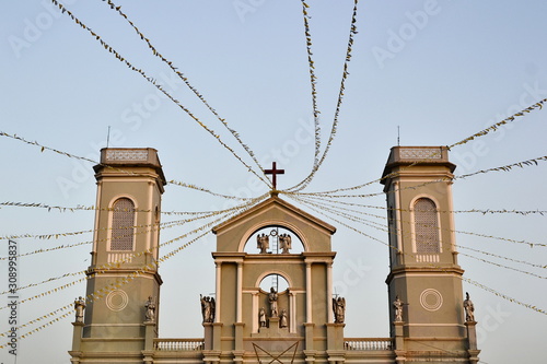 View of Milagres Church or Church of Our Lady of Miracles built in 17 century. British colonial building with two towers and catholic cross and statues. Mangalore, Karnataka, India photo
