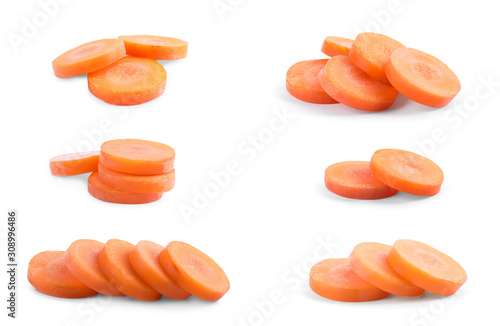 Set of cut fresh ripe carrots on white background