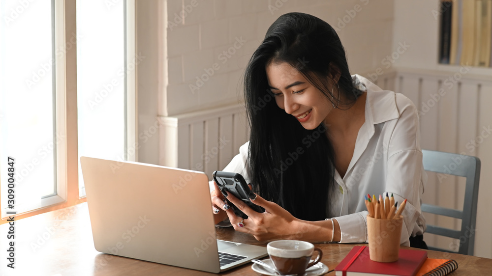 Asian woman using her smartphone and relaxing moment. Asian woman using her smartphone and relaxing moment.