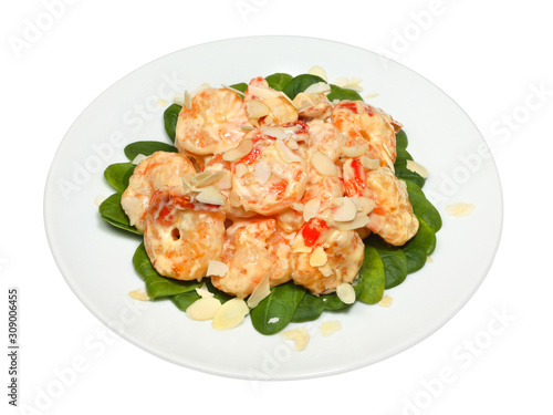 Healthy fresh salad with shrimps, spinach and almond nuts shavings