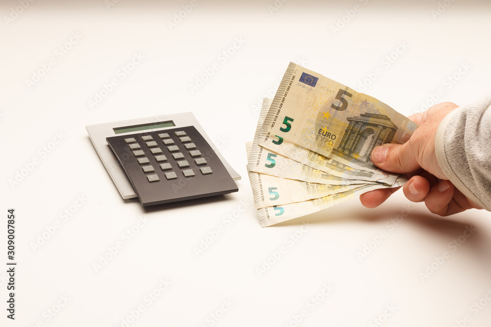 Dinero y calculadora; pérdidas y beneficios, finanzas, los negocios del dinero Dinero y calculadora; pérdidas y beneficios, finanzas, los negocios del dinero