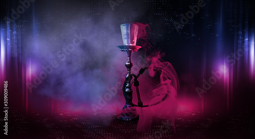 Hookah with smoke on an abstract background with neon lights.