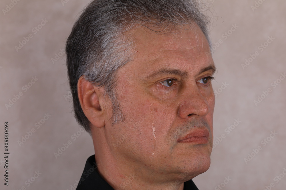Fototapeta premium male tear, face a crying man