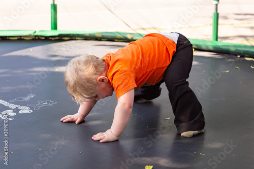 The little girl on the trampoline photo