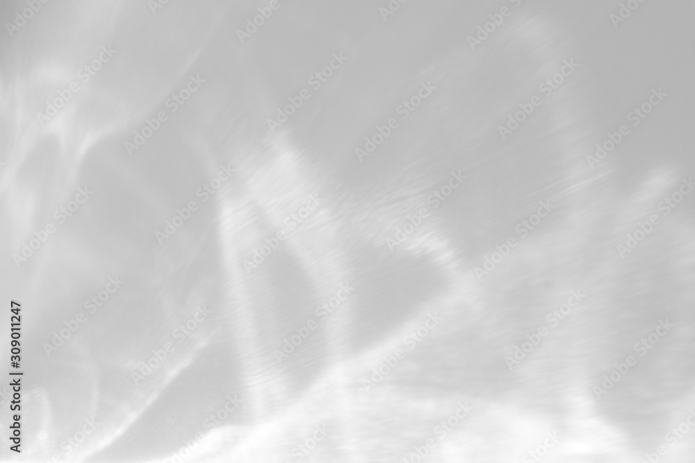 Water texture overlay effect for photo and mockups. Organic drop diagonal shadow and light caustic effect on a white wall. Water texture overlay effect for photo and mockups. Organic drop diagonal shadow and light caustic effect on a white wall.