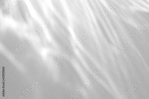 Water texture overlay effect for photo and mockups. Organic drop diagonal shadow and light caustic effect on a white wall. 