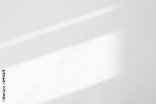 Organic drop diagonal shadow on a white wall. Overlay effect for photo, mock-ups, posters, stationary, wall art, design presentation photo