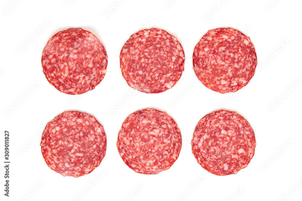 sliced smoked salami sausage on a white background sliced smoked salami sausage on a white background
