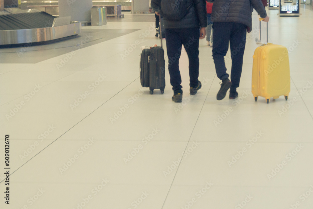 Fototapeta premium men with suitcases at the airport. journeys