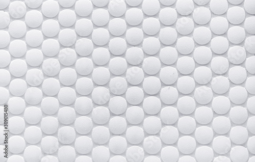 White ceramic tile with volumetric circles. White 3D background.