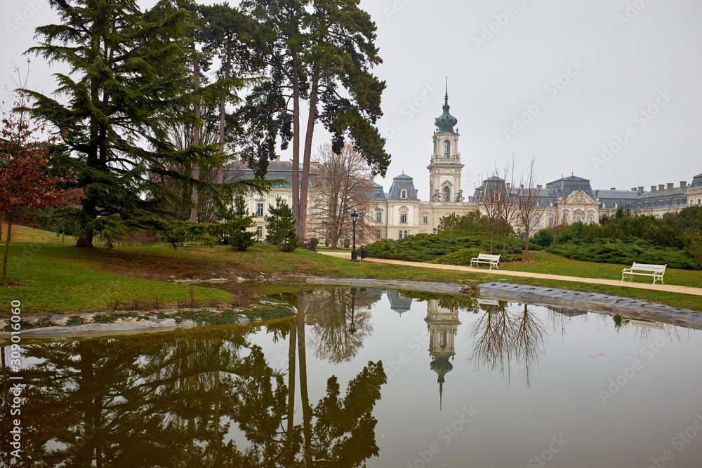 The famous Keszthely Festetics castle near to lake Balaton and Heviz with a reflection on the park lake water