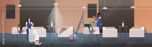 couple cleaners using rag and vacuum cleaner mix race female janitors in uniform cleaning service concept modern cafe interior horizontal full length vector illustration