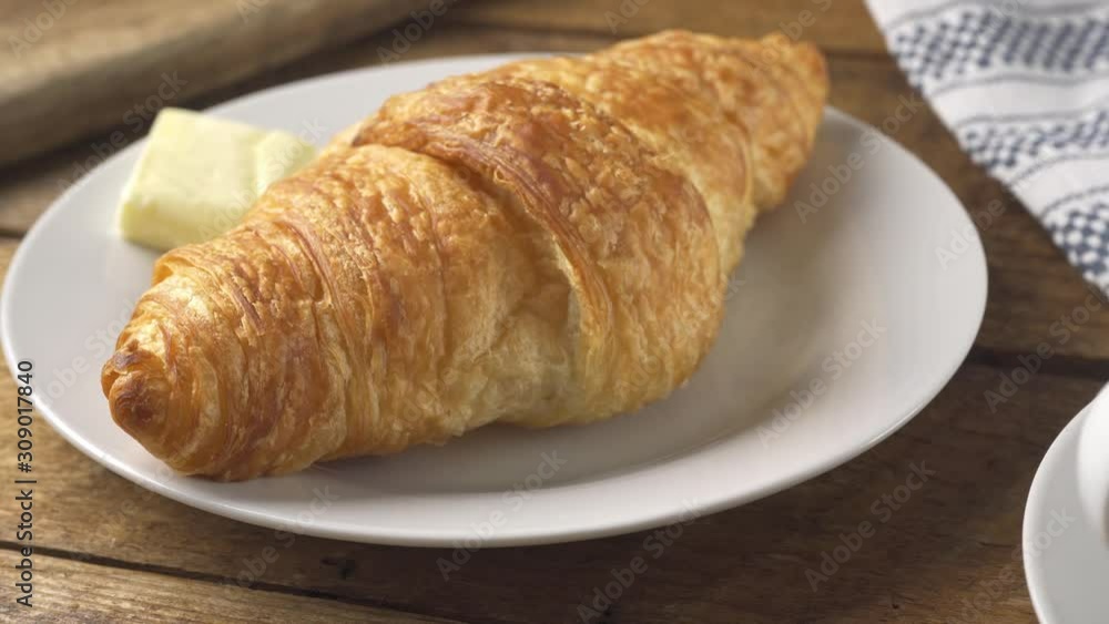 Pouring coffee and a delicious fresh croissant. Pouring coffee and a delicious fresh croissant.