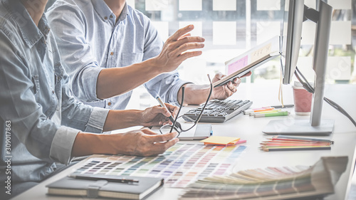 Graphic design and color swatches and pens on a desk. Architectural drawing with work tools and accessories.