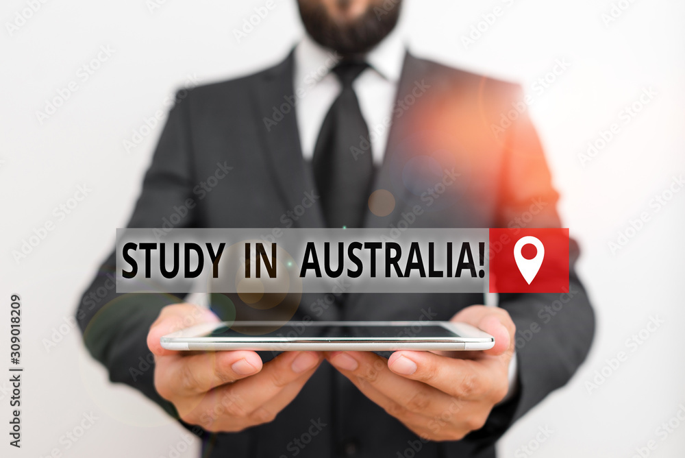 Handwriting text writing Study In Australia. Conceptual photo going into foreign country order complete your studies Male human wear formal work suit hold smart hi tech smartphone use hands Handwriting text writing Study In Australia. Conceptual photo going into foreign country order complete your studies Male human wear formal work suit hold smart hi tech smartphone use hands