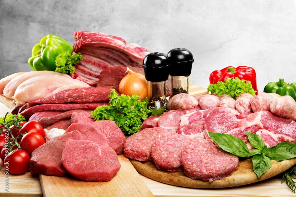 Collections fresh raw meat with vegetable on the desk Collections fresh raw meat with vegetable on the desk
