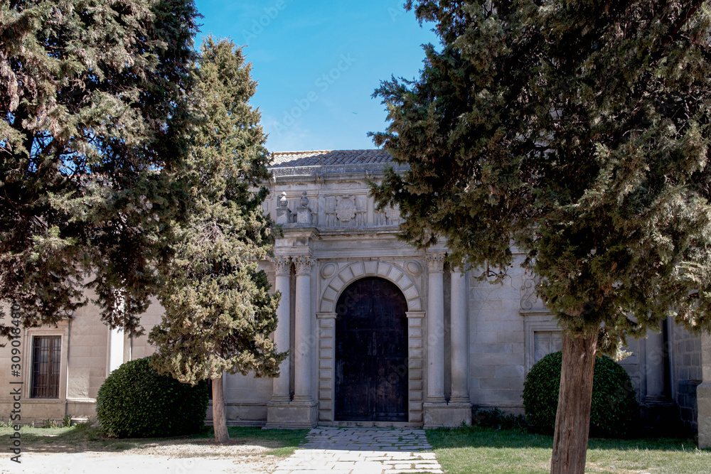 Main view of church in Avila, garden and main door, Spain