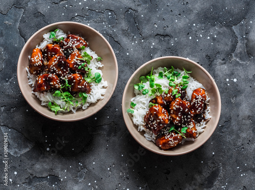 Photos Teriyaki sauce juicy chicken cubes with rice and micro greens - delicious asian
