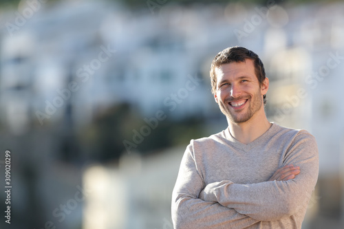 Happy confident man posing looking at camera