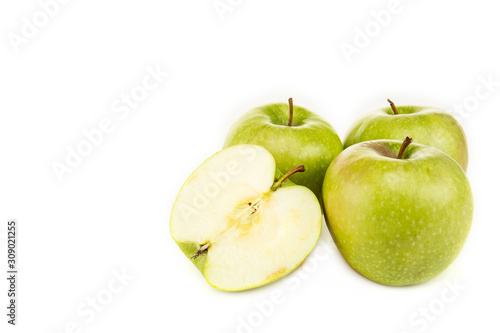 green ripe fresh apples with one half isolated on white