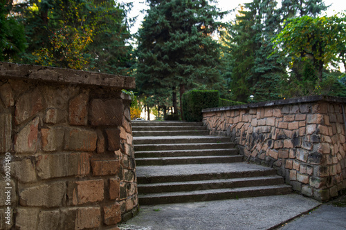 The stairs up. The stone steps. A wall along the steps. Park  city