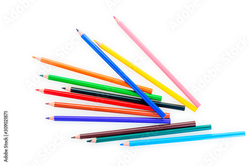 scattered set of color pencils on a white background is isolated