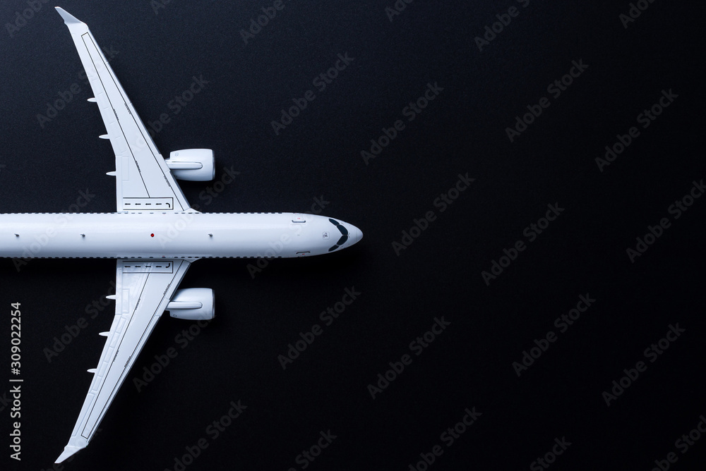 Aircraft model on black background, Top view with empty space. Concept of aircraft industry, airline safety, security and traveling insurance