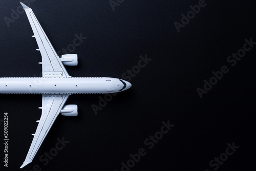 Fototapeta Aircraft model on black background, Top view with empty space