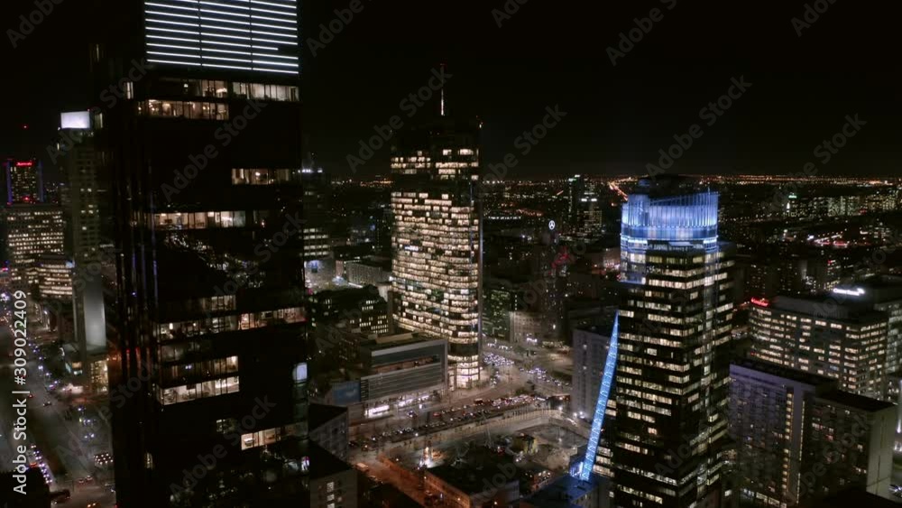 Aerial view of night Warsaw with skyscrapers in a business center. Poland. 04. December. 2019. Drone view of the night city with skyscrapers and busy streets with traffic jams during rush hour. 4K. Aerial view of night Warsaw with skyscrapers in a business center. Poland. 04. December. 2019. Drone view of the night city with skyscrapers and busy streets with traffic jams during rush hour. 4K.