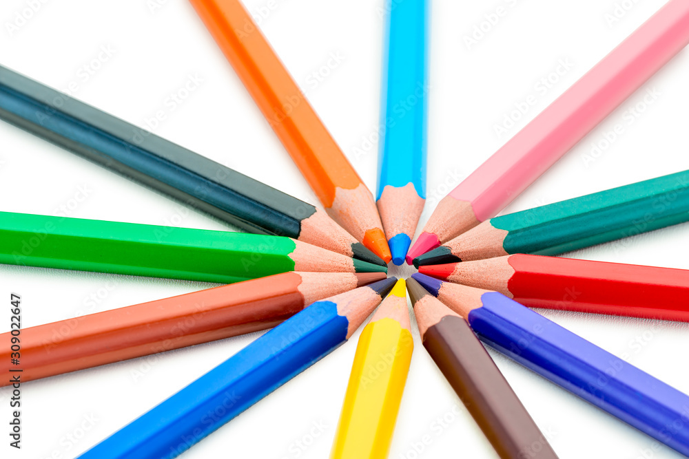 multicolored palette of pencils on a white background