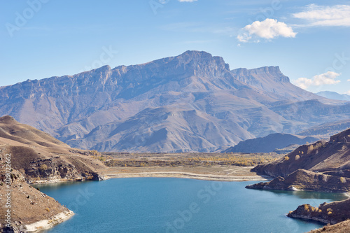 a huge mountain range and a lake in the mountains 