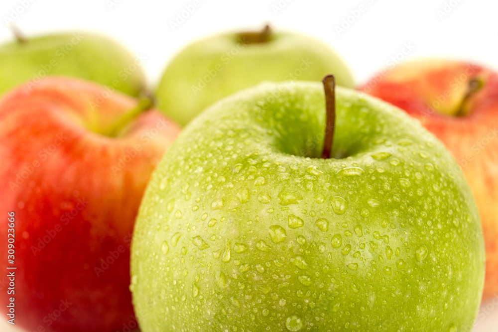 selective focus of green ripe wet apple isolated on white selective focus of green ripe wet apple isolated on white