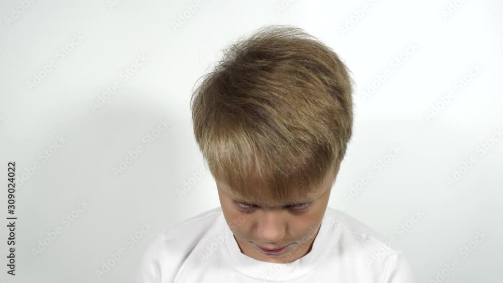 Vidéo Stock Closeup front view portrait of cute funny caucasian kid ...