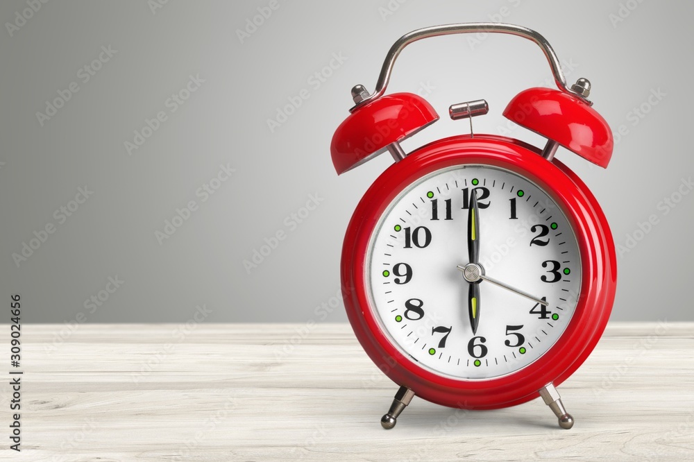 Retro classic alarm clock on background Retro classic alarm clock on background