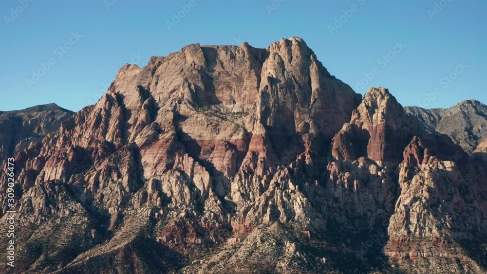Aerial pullback shot of the massive Mount Wilson mountains in Red Rock Canyon Aerial pullback shot of the massive Mount Wilson mountains in Red Rock Canyon