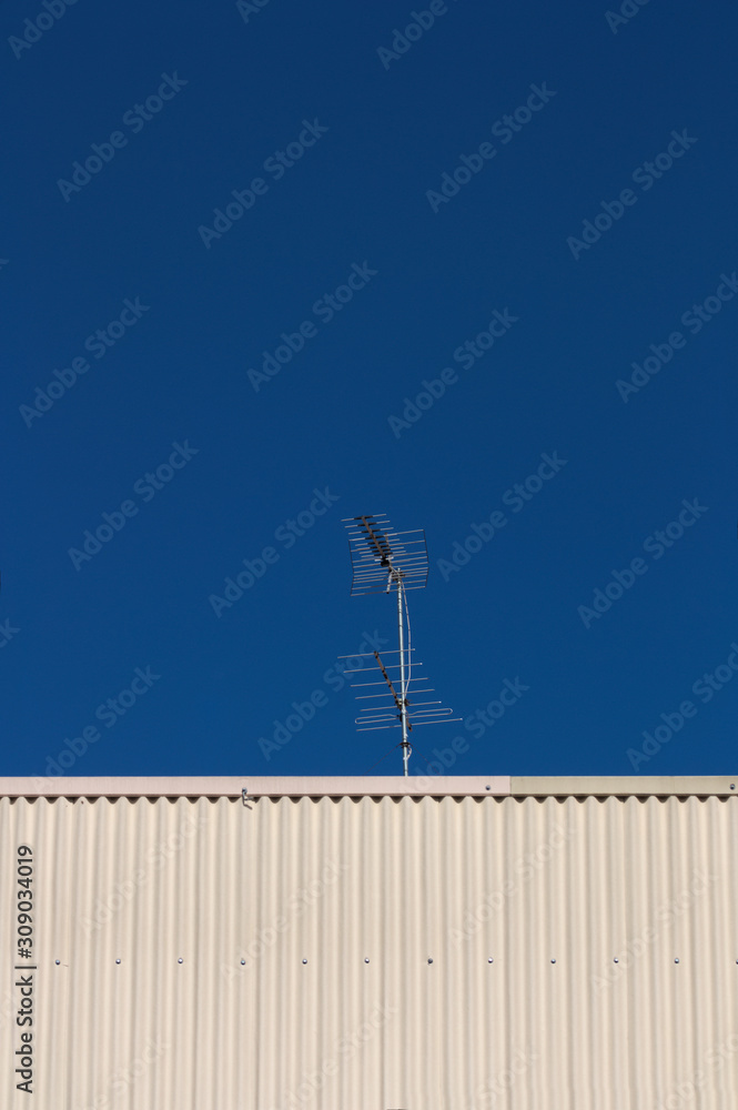 Digital terrestrial television (DTT) antenna with blue sky in the background Digital terrestrial television (DTT) antenna with blue sky in the background