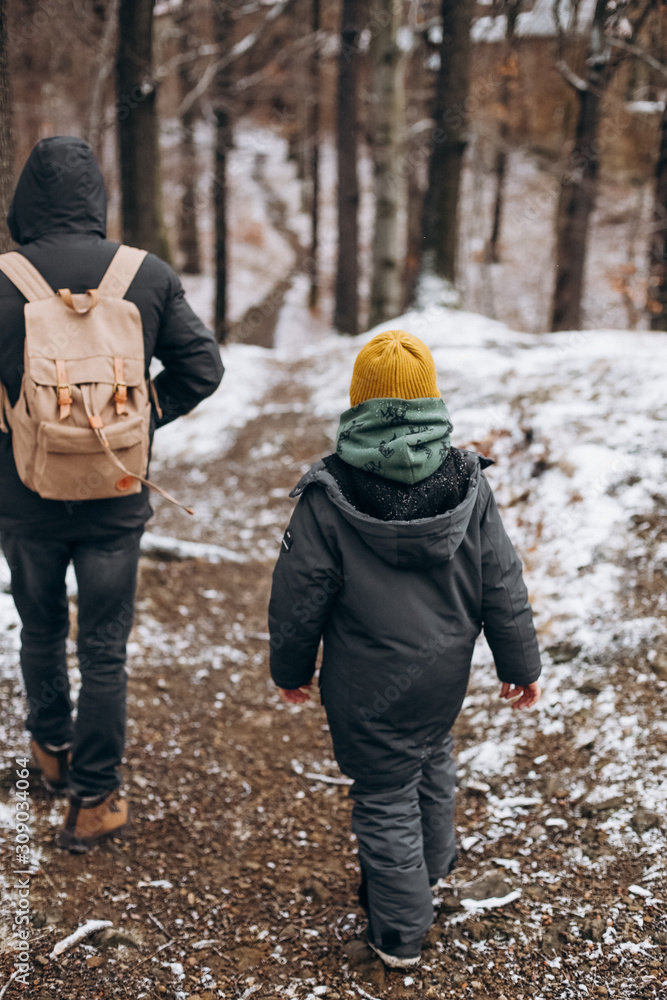 father son walk path winter travel backpack father son walk path winter travel backpack