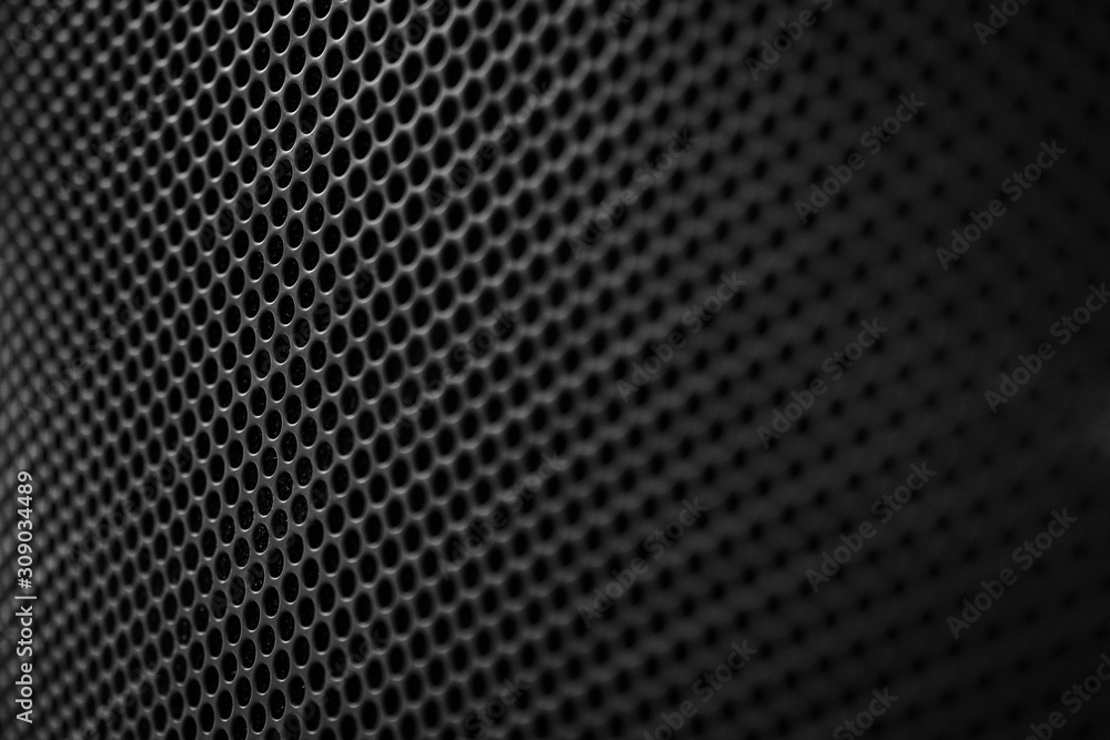 Stylish metal grid on a modern acoustic system. Stylish metal grid on a modern acoustic system.