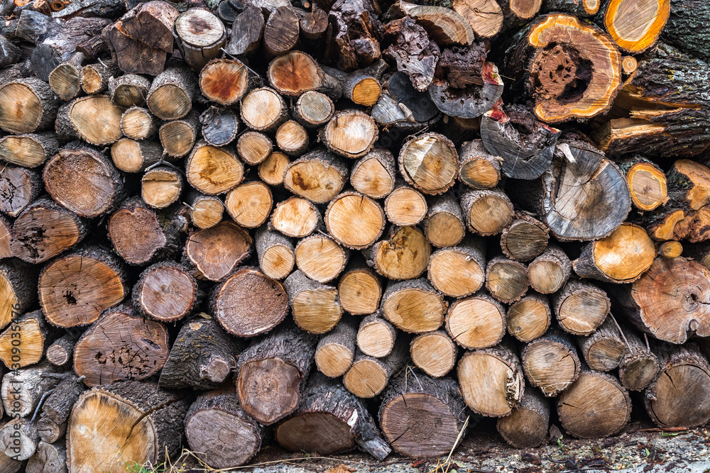Firewood background. Preparation of firewood for the winter. Firewood background. Preparation of firewood for the winter.
