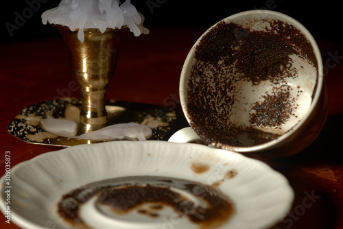 fortune telling on coffee grounds. mug and saucer photo