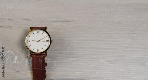 Close up macro watch on grey wooden board (ID: 309035893)